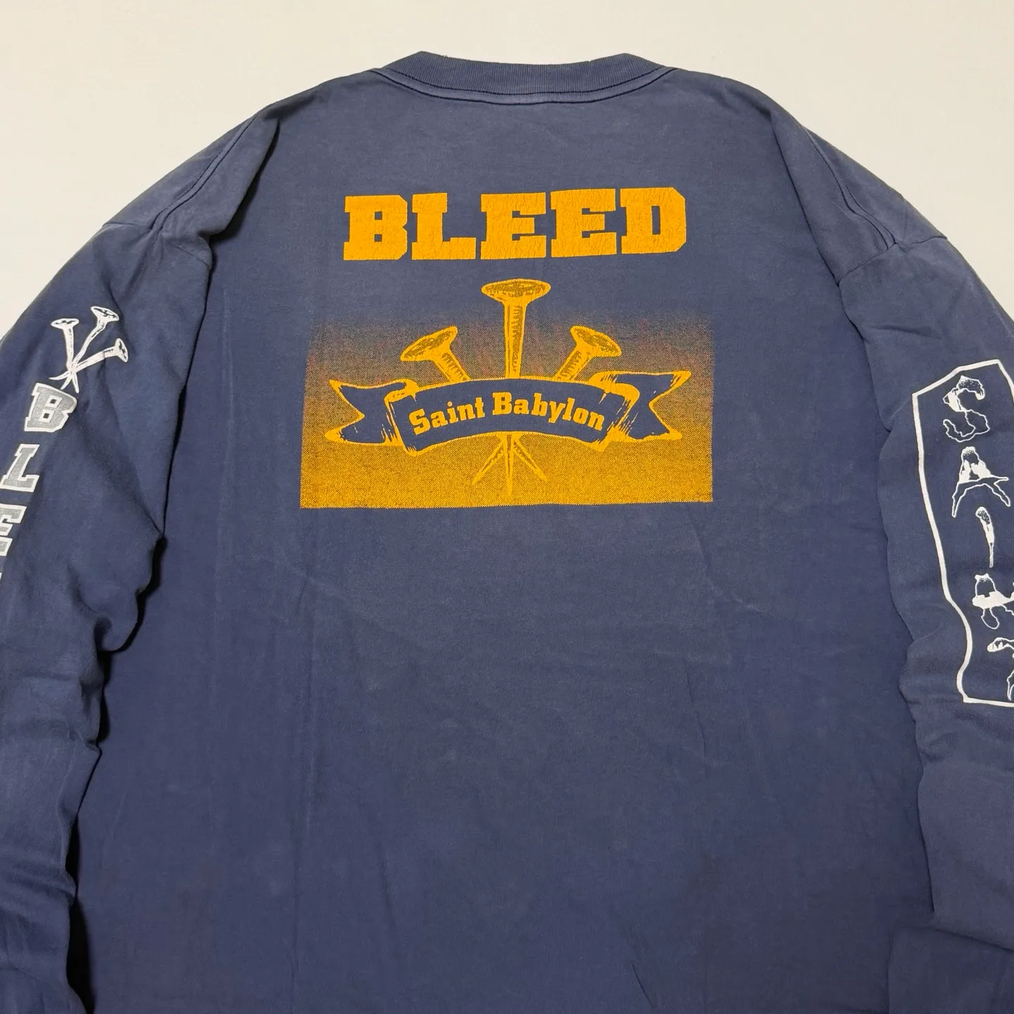 SAINT Mxxxxxx × BABYLON BBLN_LS TEE/SAINT BABYLON/NVY/BABYLON co-branded style Wolf head SAINT/nail distressed long sleeves Washed blue S-XL Completely matched Tube weaving fabric without side seams Garment dyeing Maliu water faded distressing Simulated sun fading treatment Natural fading Handmade holes and frayed Ink splashing treatment Correct main mark/wash mark/little angel anti-counterfeiting mark
